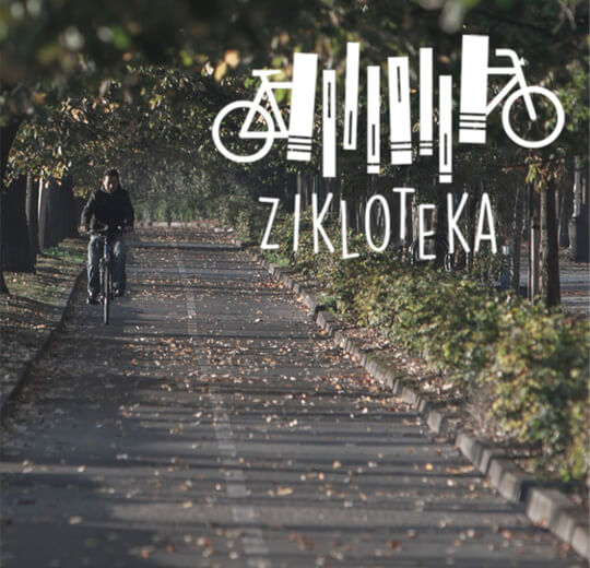 Cartel Zikloteka con una persona paseando en bicicleta
